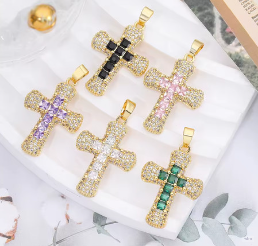 Original reference showing gold-tone cross pendants with colored stone detailing